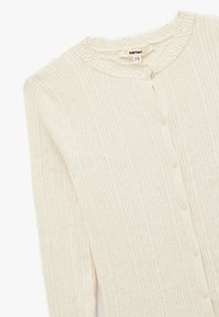 Geripptes cremfarbiges Cardigan mit rundem Halsausschnitt und dekorativer Stickerei, vorderer Knopfverschluss und weichem, strukturiertem Stoff.
