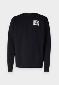 Felpa nera in misto cotone, con collo a giro, maniche lunghe e una grafica quadrata bianca con la scritta "HUF AS SEEN ON TV" sul petto.