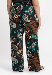 Mustat leveälahkeiset housut, joissa on värikäs paisley-kuvio teal, ruskea ja kerma. Valmistettu sileästä kankaasta, jossa on joustava vyötärönauha.