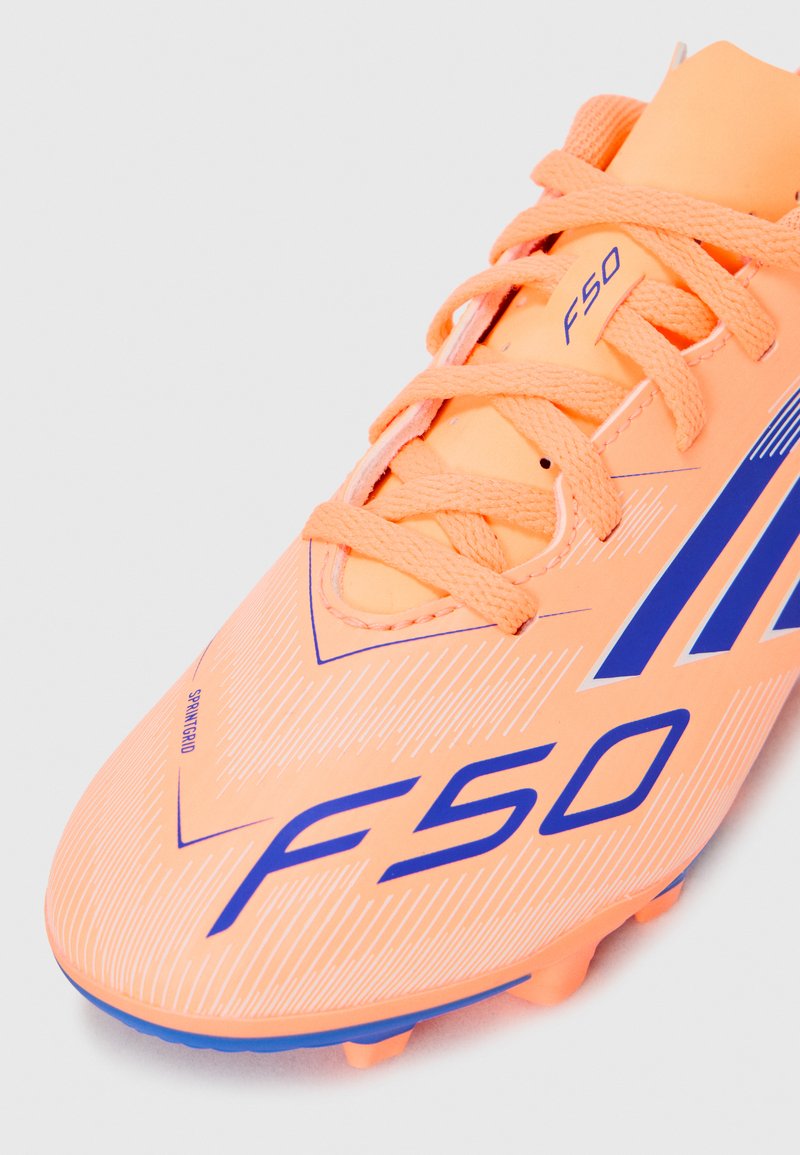 adidas Performance F50 CLUB UNISEX - Firm-ground football boots - beam  orange/lucid blue/white/orange - Zalando.co.uk