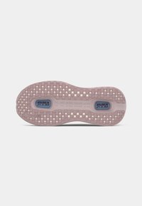 Nike Air Zoom shoe outsole in light pink with a grid pattern. Features prominent "AIR ZOOM" branding and textured surface for grip.