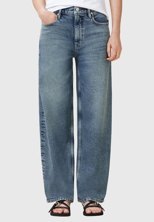 Jeans in denim blu a gamba larga con vita alta, cuciture a contrasto e finitura sbiadita. Presentano tasche laterali e chiusura con zip.