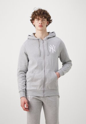 Gray zip-up hoodie made of soft fabric, featuring a front pocket and white logo on the left chest. Casual design with a hood and ribbed cuffs.