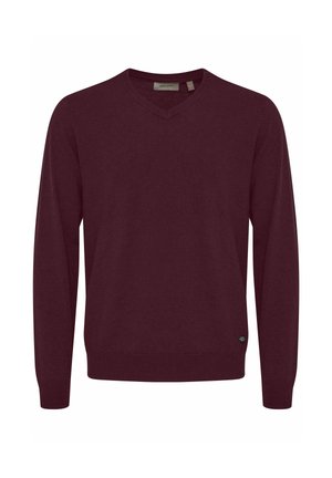 Burgundský svetr s výstřihem do V vyrobený z měkké pleteniny. Obsahuje žebrované manžety a lem, a malou logo nášivku v dolním levém rohu. Standardní střih.