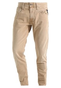Beige jeans made of cotton denim, featuring a classic fit, five pockets, and subtle fading with a zip and button closure.