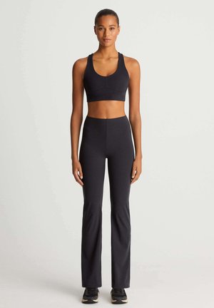 RAISE UP COMPRESSIVE - Trousers - black