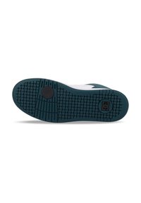 Teal rubber shoe sole featuring a textured, patterned grip. Includes a black circular accent and a logo embossed in black.