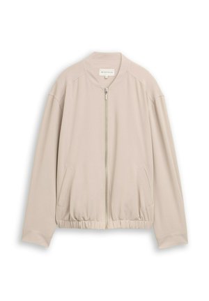 Veste bomber beige avec fermeture éclair, col côtelé, ourlet élastiqué et poches latérales. Fabriquée dans un tissu léger et lisse.
