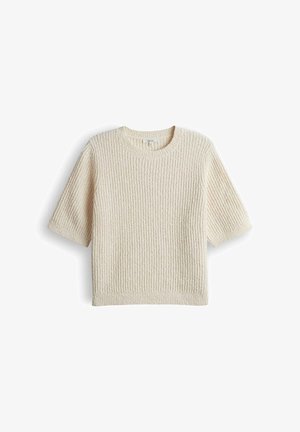 Pull en tricot à manches courtes de couleur crème avec une texture côtelée et un col rond, présenté à plat sur un fond blanc.