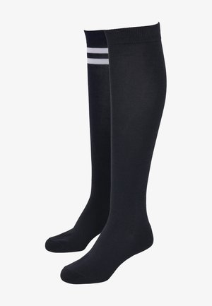 Černé ponožky po kolena vyrobené z měkkého materiálu, s dvěma horizontálními bílými pruhy na vršku. Hladký povrch, přiléhavý design.