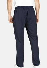 Navy Baumwollhosen mit elastischem Bund und einer Gesäßtasche, die ein gerades Bein-Design und eine glatte Textur aufweisen.