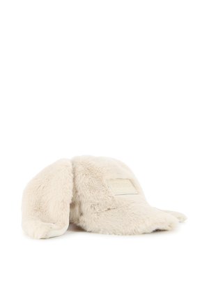 Bonnet d'hiver beige et duveteux avec de longues oreilles et un patch rectangulaire sur le devant, photographié sur fond blanc.