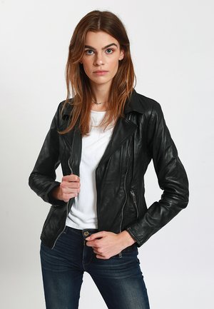Black leather motorcycle jacket with a fitted design, featuring a notched collar, zippered pockets, and smooth texture. Worn over a white shirt.