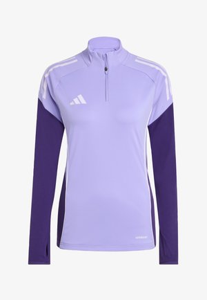 Haut de sport violet clair avec de longues manches violettes, un col zippé et des accents blancs. Fabriqué en matériau évacuant l'humidité, avec une coupe ajustée.