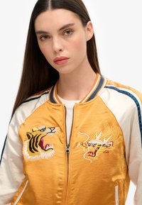 Superdry & Co IKAJAN pomarańczowy