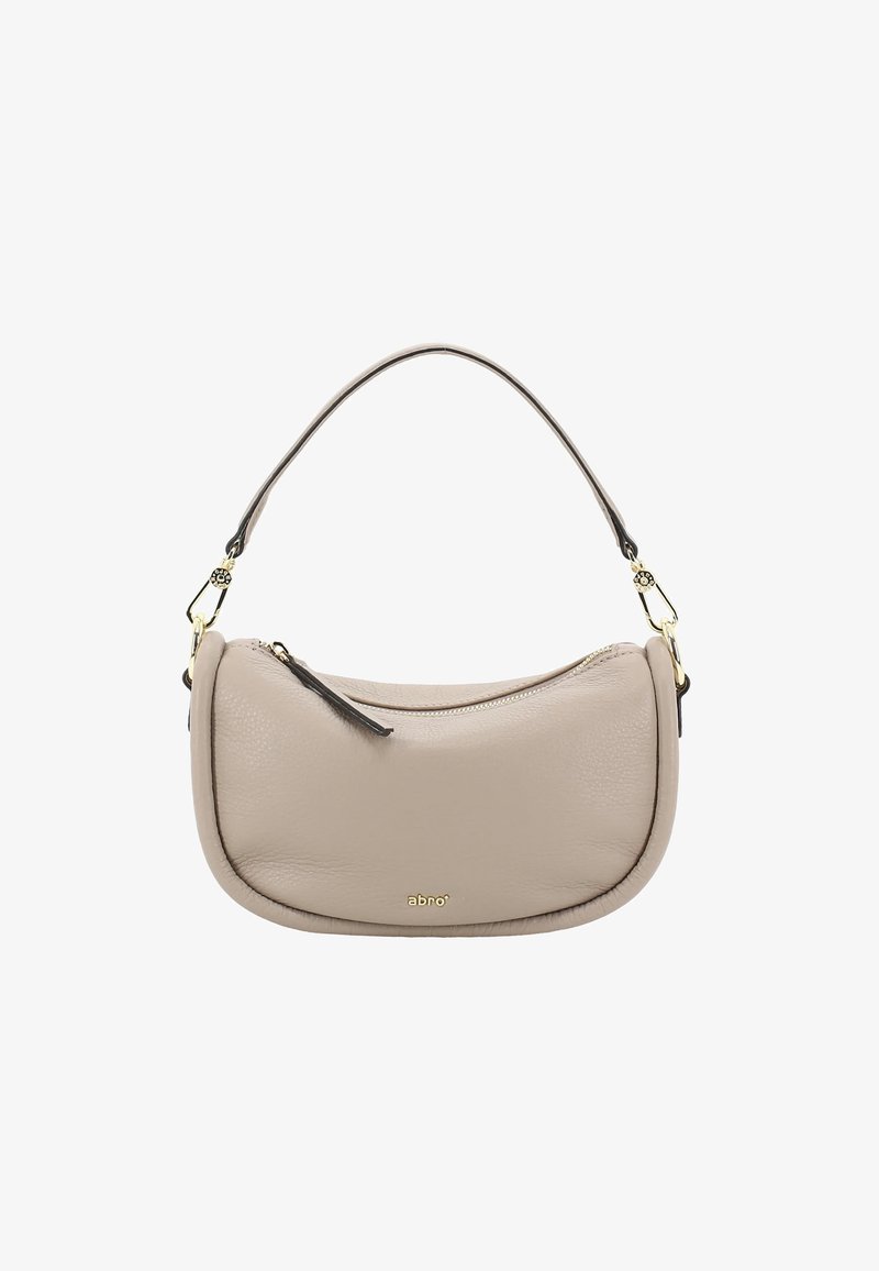 Beige Ledertasche mit geschwungener Form, kurzem Henkel, goldenem Reißverschluss und einer kleinen Lederquaste als Akzent. Logo auf der Vorderseite geprägt.