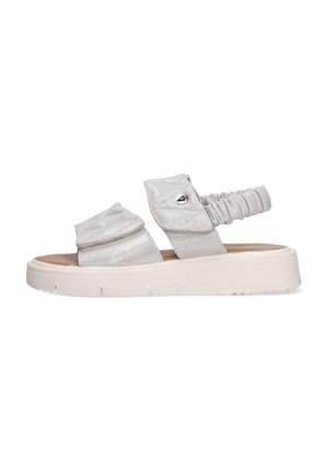 Witte sandalen met kussen, dikke zool, twee verstelbare riemen en een elastische achterriem, zijaanzicht op een witte achtergrond.