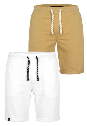 Two pairs of casual shorts with drawstring waistbands, one beige with white drawstrings and one white with black drawstrings, both with rolled hems.