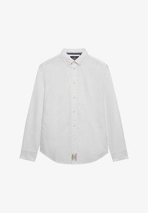 Wit overhemd met lange mouwen, knopen en een button-down kraag, met een klein stoffen label aan de onderkant van het voorste midden.