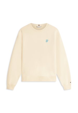 Sweat-shirt couleur crème avec un col rond côtelé, des manches longues et un logo frontal en bleu clair. Présente un ourlet droit et une texture subtile.