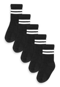 Chaussettes noires avec des rayures blanches en haut, présentant une texture côtelée. Cinq paires soigneusement disposées pour l'exposition.