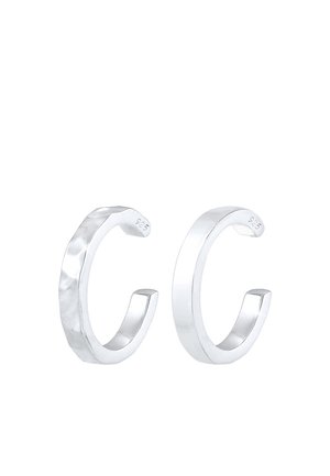 Two silver open hoop earrings, one with a hammered texture and the other smooth, both marked "925" for sterling silver.
