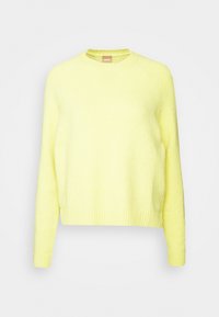 Hellgelber Pullover aus weichem, strukturiertem Strick. Verfügt über einen runden Halsausschnitt sowie gerippte Bündchen und Saum. Für eine lockere Passform entworfen.