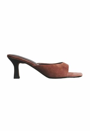 Brown suede open-toe mule with a mid-height curved block heel and slip-on design on a white background.