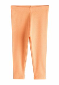 Hellorange gerippte Leggings mit enger Passform, glatter Textur und elastischem Bund. Keine zusätzlichen Muster oder Verzierungen.