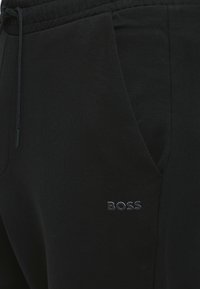 BOSS HADIKO - Tracksuit bottoms - black one