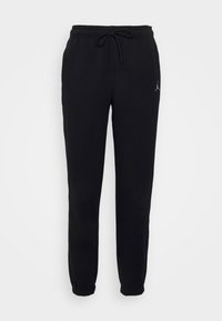 Svarta sweatpants i mjuk bomull, med dragsko i midjan, elastiska manschetter och en liten logotyp på vänster överben.
