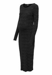 Svart långärmad graviddress med en texturerad design som har vågiga mönster, rund halsringning och en figurnära silhuett.