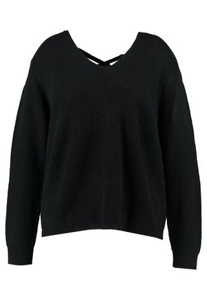 Black, oversized knit sweater with a V-neck and cross-back design. Features ribbed cuffs and hem for added texture.