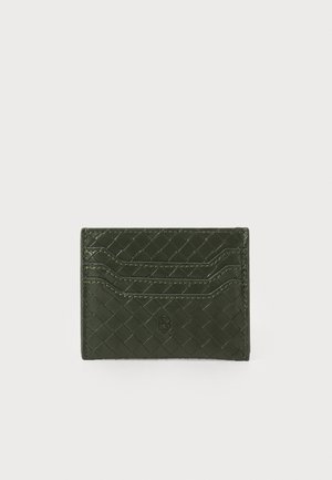 Woven green leather cardholder with six card slots, featuring a textured surface and subtle branding on the front.