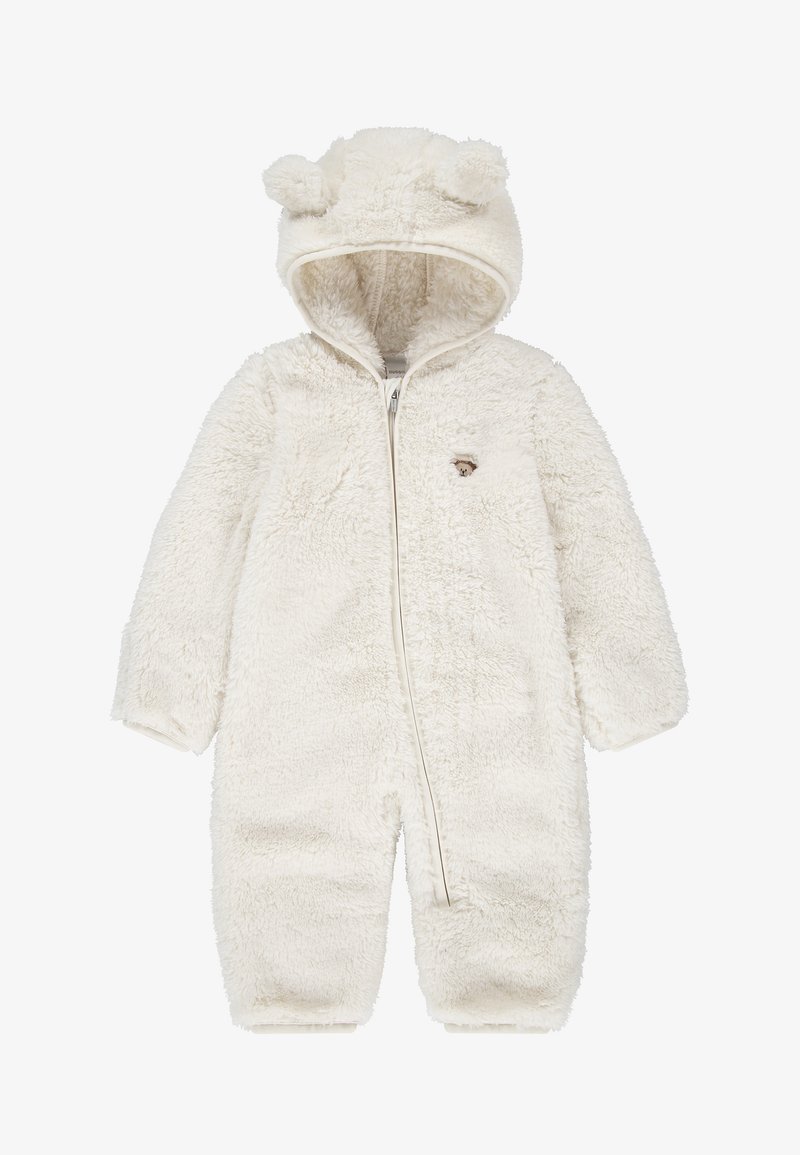 Combinaison blanche et duveteuse pour bébé avec capuche avec oreilles d'ours et un petit patch visage d'ours sur la poitrine, fermeture éclair à l'avant.