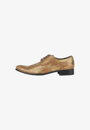 Golden-brown dress shoe with a textured snake pattern, pointed toe, black sole, and lace-up design with three eyelets.