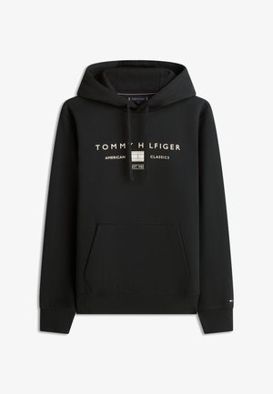 Sweat à capuche noir avec poche devant, capuche à cordon, et texte blanc "Tommy Hilfiger American Classics Est. 1985" ainsi que logo sur la poitrine.
