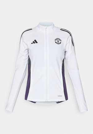 Giacca bianca con zip e maniche lunghe, dettagli neri e viola sui lati, con un logo sul petto e tre strisce nere sulle spalle.