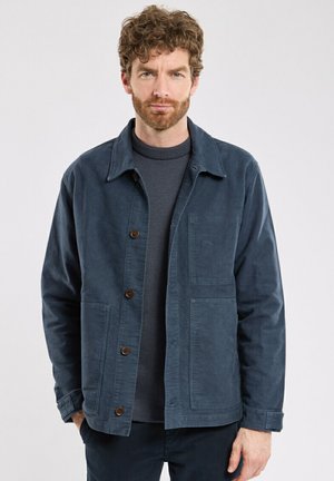 Navy blue jacket made of textured fabric, featuring a collared neck, button closure, and two front pockets.