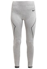 Szare legginsy wykonane z elastycznego materiału z czarnymi akcentami. Charakteryzują się dopasowanym krojem, prążkowanym pasem w talii oraz logo na dolnym obszyciu.