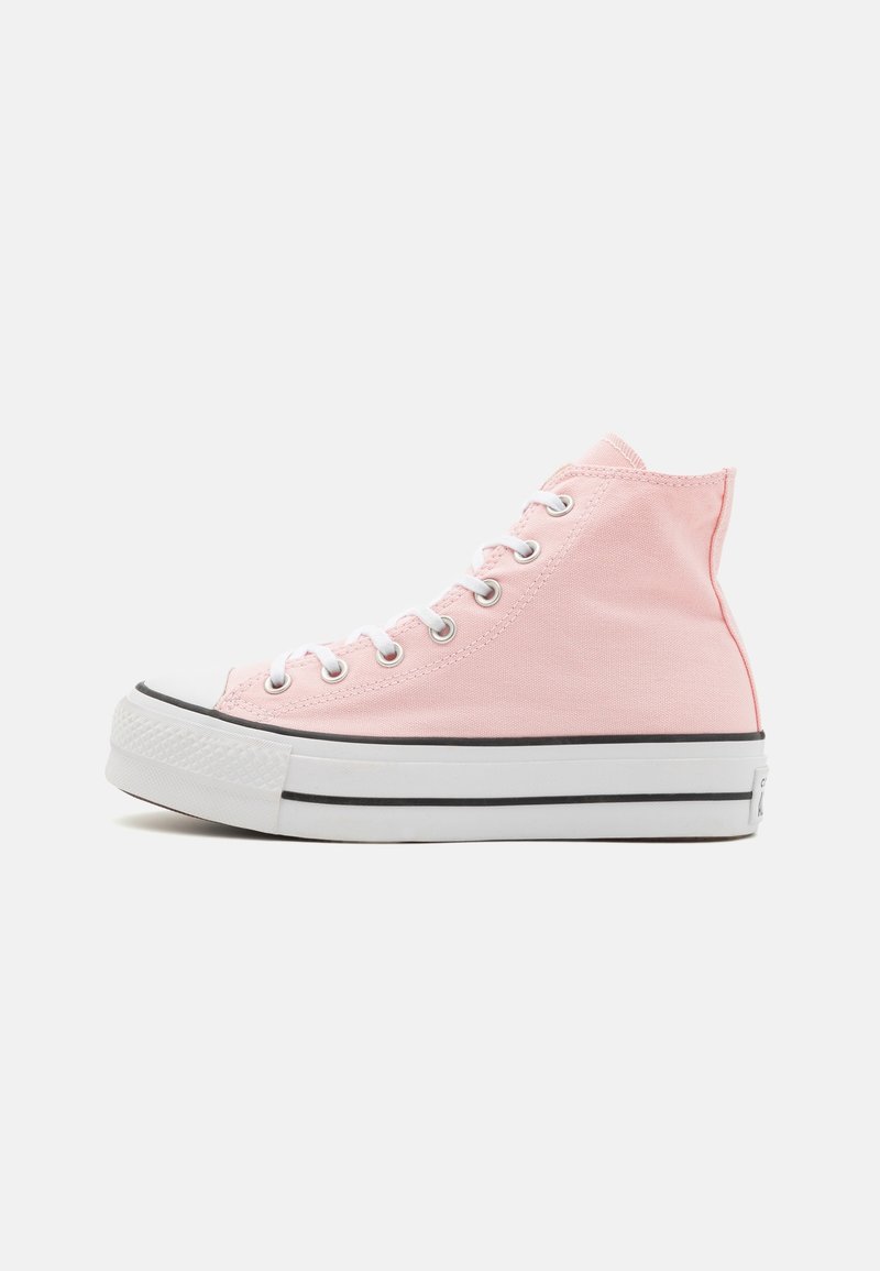 High-top sneaker in light pink canvas with white rubber sole, black stripe, and silver eyelets for laces. Classic design and simple construction.