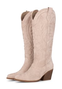 Botas de vaquero de ante beige con patrones florales bordados, punteras puntiagudas y un tacón medio en bloque. Incluye tiradores para facilitar su uso.