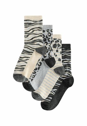 Cinq paires de chaussettes avec divers motifs : zèbre, léopard et rayures dans des teintes de beige, gris et noir. Matériau en mélange de coton.