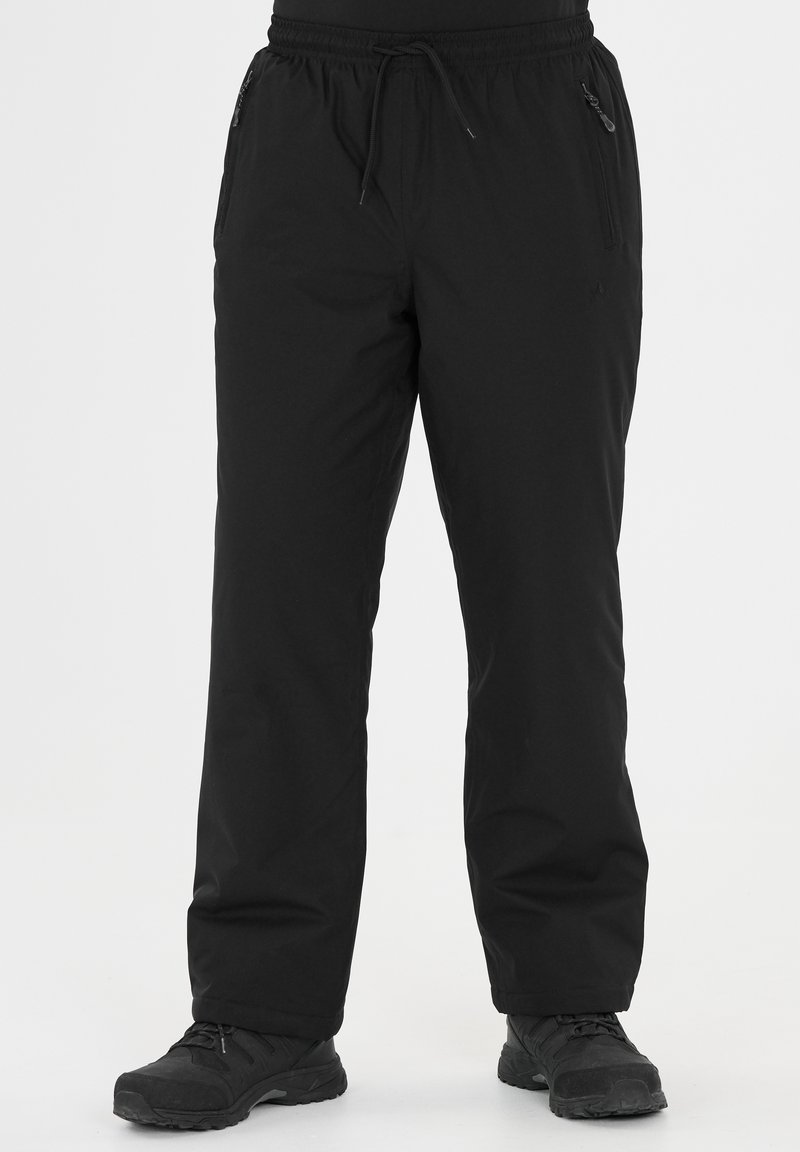 Pantalons d'extérieur noirs en matériau léger, dotés d'une taille élastique, de deux poches latérales zippées et d'une coupe droite.