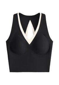 Crop top noir sans manches avec une bordure blanche en V au col et une découpe profonde en forme de goutte d'eau sur la poitrine.