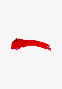 Red lip product spread in a curved line, featuring a glossy texture with smooth application and a vibrant, rich color.