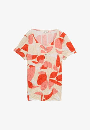 Short-sleeve, v-neck shirt in wrinkled cream fabric with large red and pink floral patterns; three front buttons add detail.
