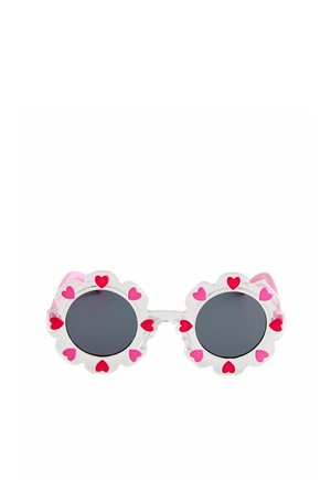 Round sunglasses with dark lenses and clear frames shaped like flowers, decorated with pink and red heart patterns.