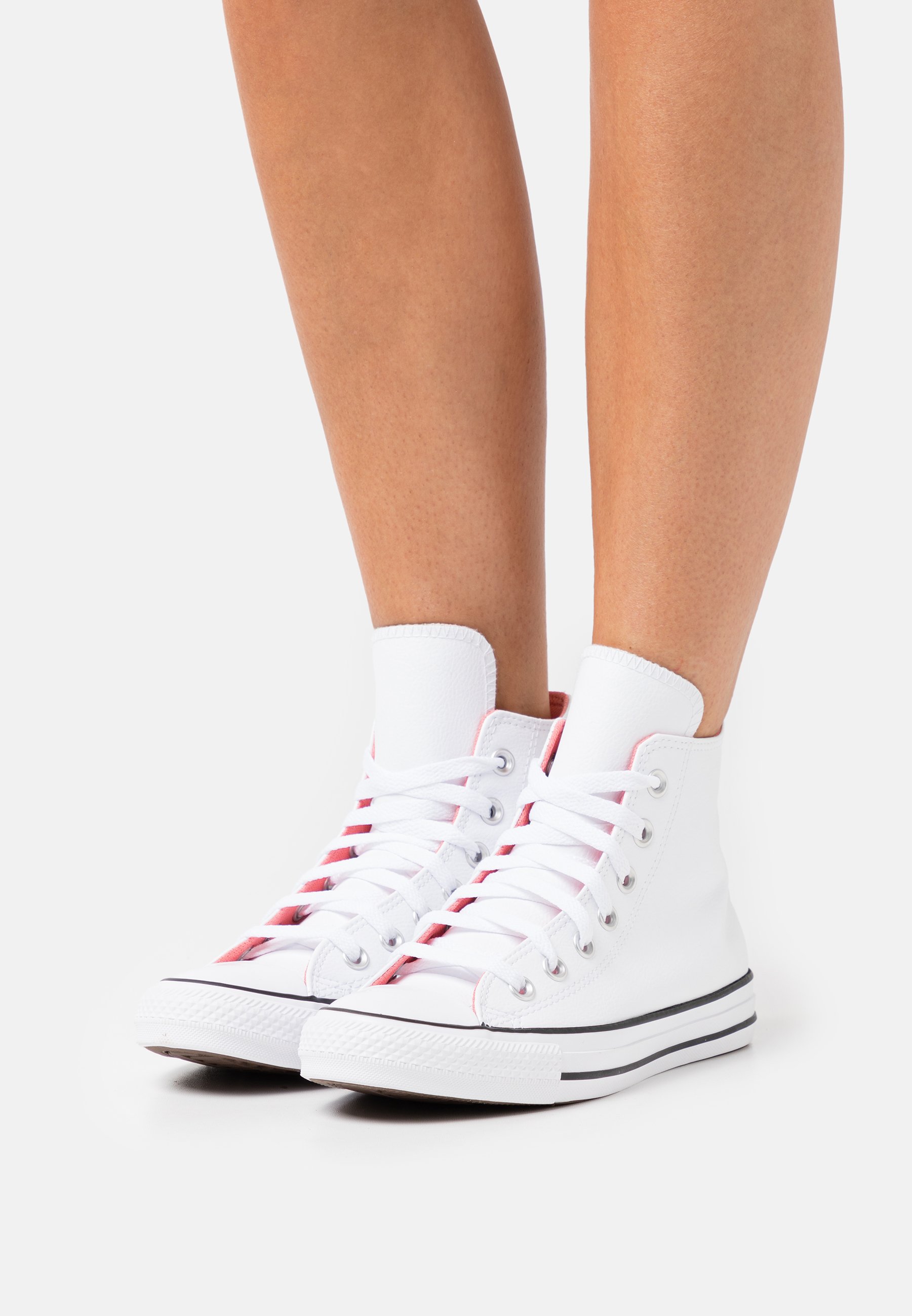 pink and white high top converse
