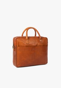 Brown leather briefcase with dual handles, zip closure, front pocket, and subtle embossed logo. Smooth texture and structured design.